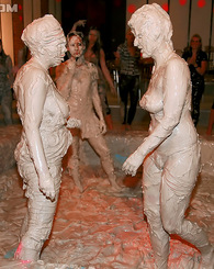 Sweet willing teenage girls getting dirty in a mud pool